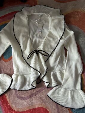Ruffles white cardigan with black trim